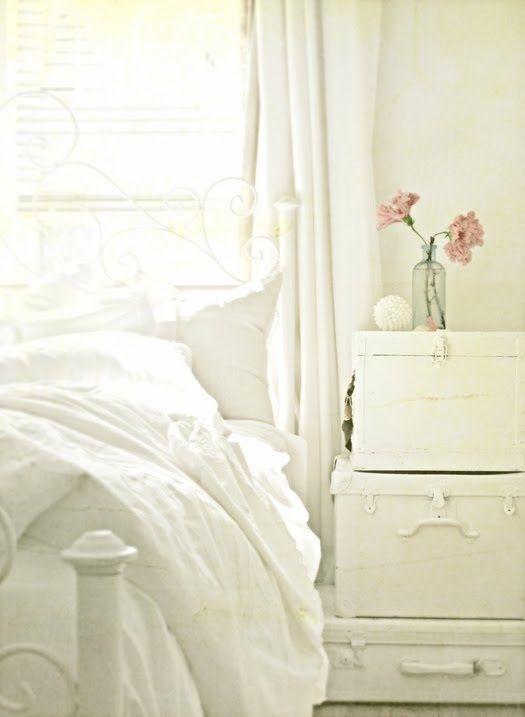 Painted suitcases as bedside table