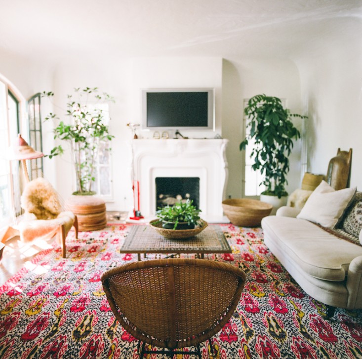 1. The rug and woven chair add a boho feel to a neutral room
